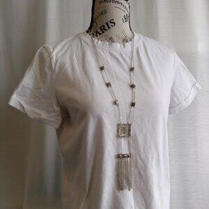 Unique and intricate statement necklace made of silver chains and pendants